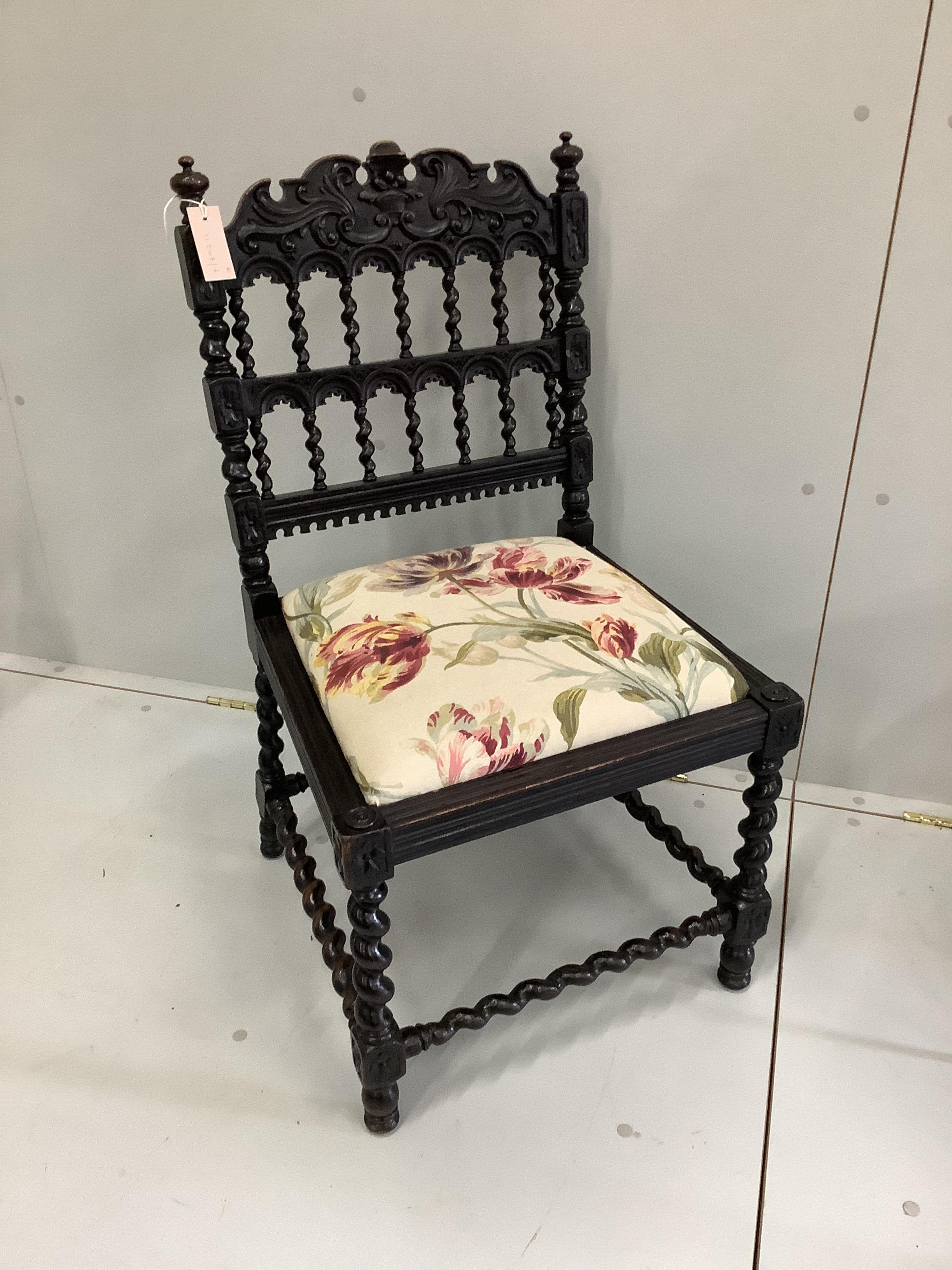 A Fornasetti style occasional table, diameter 52cm, height 48cm, together with a late 19th century Flemish carved side chair